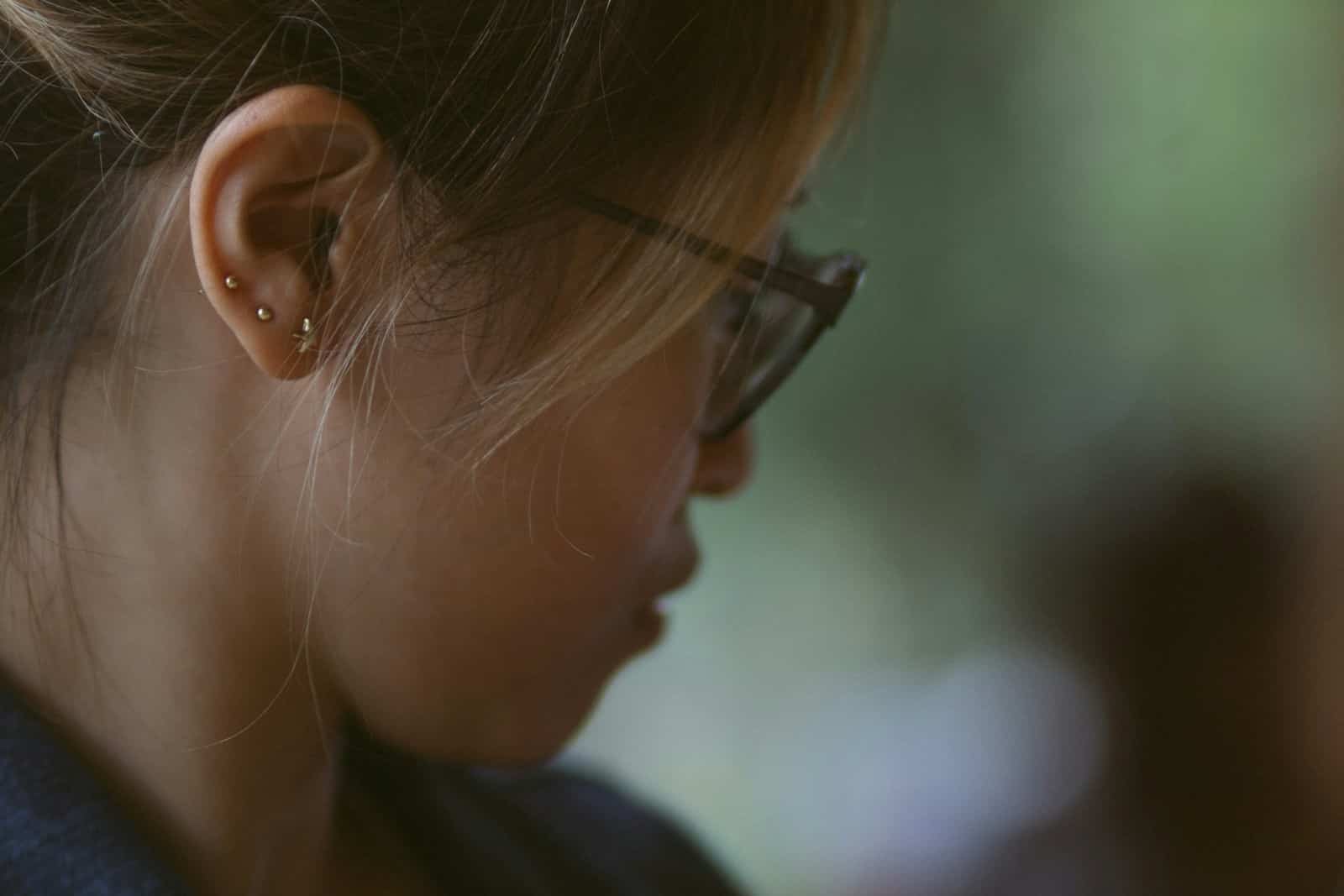 a close up of a person wearing glasses