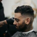 man in black and white striped shirt