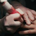 A close up of a person holding another person's hand